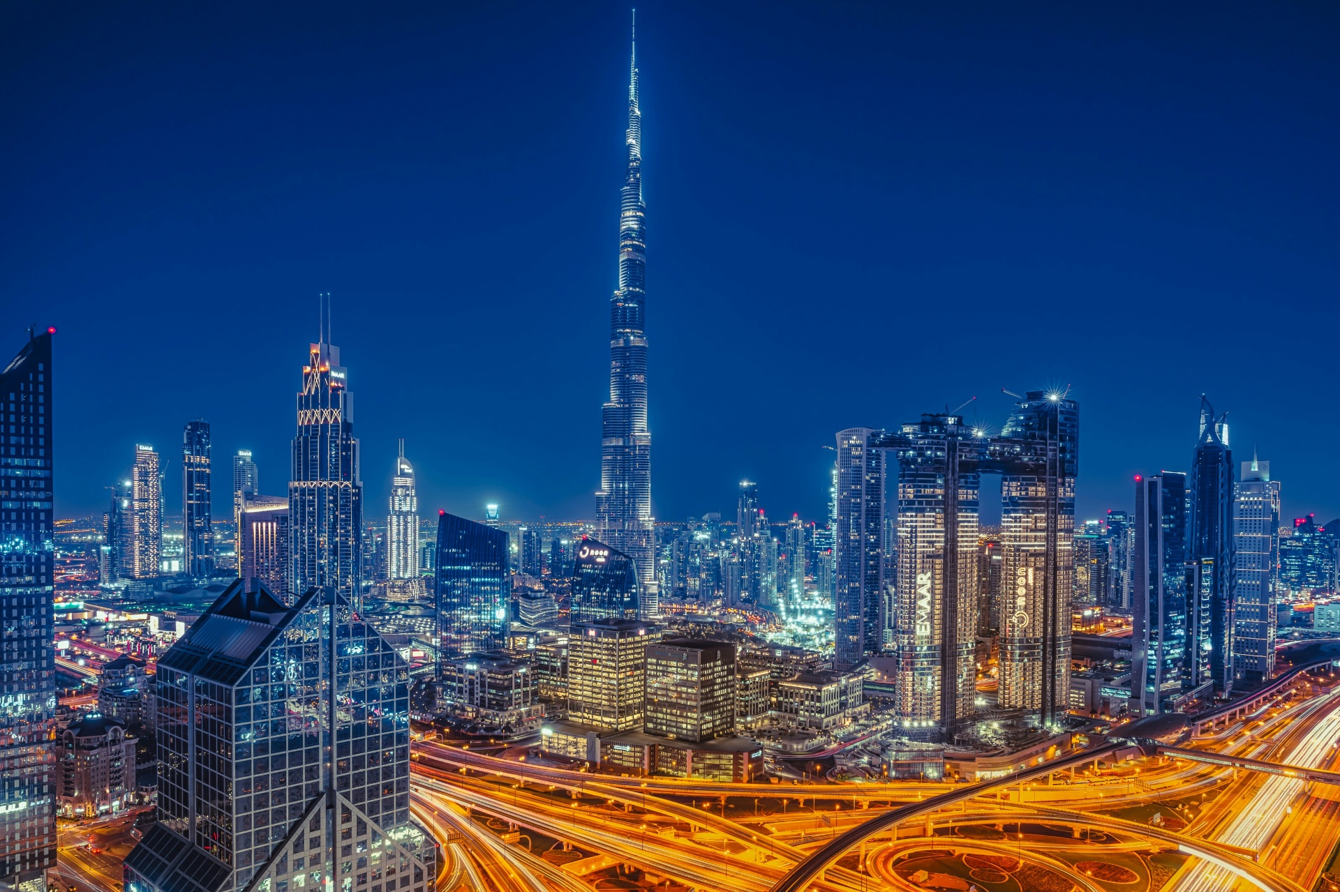 Downtown Dubai skyline at night with Burj Khalifa and Sheikh Zayed Road